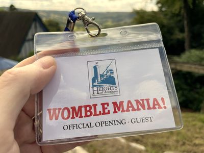 Lanyard badge saying 'Womble Mania! Official opening - guest'