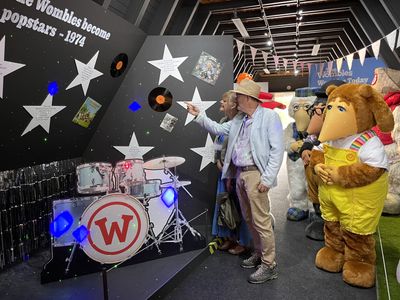 Marcus and Marianne look at the exhibition Marcus and Marianne looking at the exhibition, with the Wombles watching
