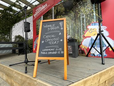 Blackboard saying 'Official opening today - ceremony 11.15, public opening 12.30'