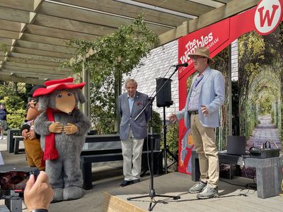 Marcus Robertson makes his speech Marcus Robertson makes a speech, with Rupert Pugh and the Wombles watching